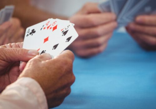 Retired,People,Playing,Card,In,A,Retirement,Home